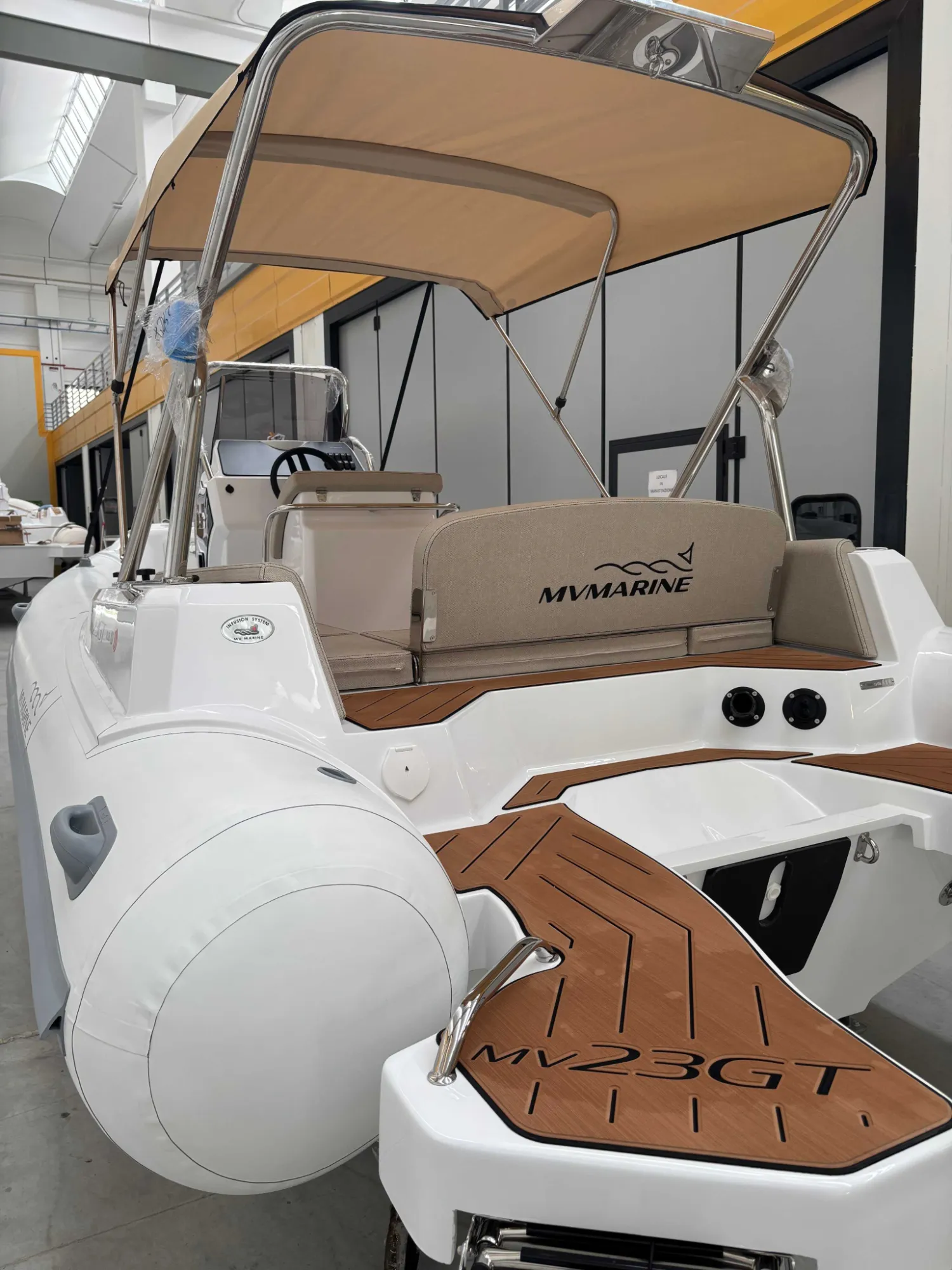 MV 23GT RIB stern with bimini top and teak swim platform